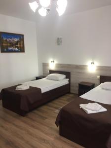Postel nebo postele na pokoji v ubytování Hotel Karpaty