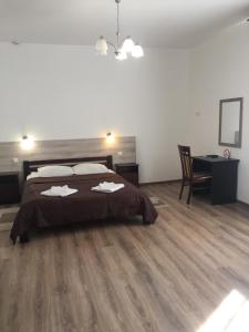 Postel nebo postele na pokoji v ubytování Hotel Karpaty