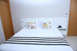 Postel nebo postele na pokoji v ubytování Ventura Hotel