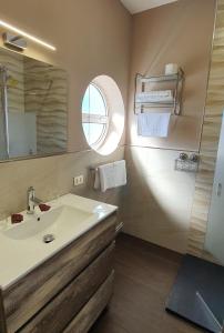 a bathroom with a sink and a mirror at Hotel Prados in Lugo