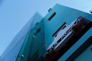 a building with a train on the side of it at HOTEL AZUL AGAVE in Arandas