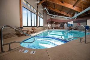 a large indoor swimming pool in a building at Grand Canyon Hotel & Suites in Tusayan