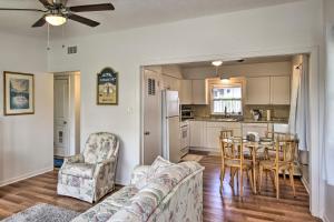 a living room with a couch and a table at Sunny Cocoa Beach Home Walk to Sea and Attractions! in Cocoa Beach