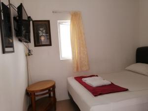 Postel nebo postele na pokoji v ubytování Rasa Motel