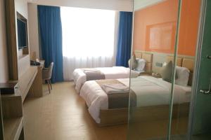 PACI Hotel&SPA客房内的一张或多张床位
