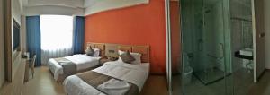 PACI Hotel&SPA客房内的一张或多张床位