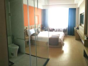 PACI Hotel&SPA客房内的一张或多张床位