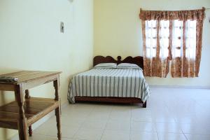 Ein Bett oder Betten in einem Zimmer der Unterkunft Posada Lilia