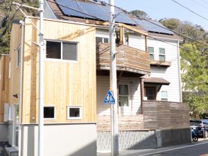 a house being constructed on a street corner at FLAG Zushi in Zushi