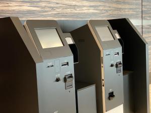 a row of lockers sitting next to each other at Hotel Trusty Osaka Abeno in Osaka