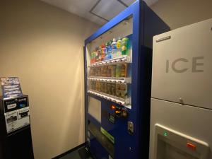 a ice machine with drinks in it in a room at Hotel Trusty Osaka Abeno in Osaka