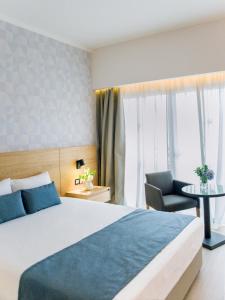 Кровать или кровати в номере Ajax Hotel