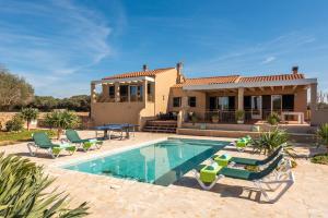 a villa with a swimming pool and a house at Villa Flomertor 1 by Mauter Villas in Ciutadella