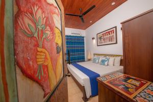 Ένα ή περισσότερα κρεβάτια σε δωμάτιο στο Blue Elephant Boutique Hotel +62 φωτογραφίες