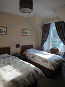 Postel nebo postele na pokoji v ubytování Fassfern Guesthouse