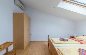 Postel nebo postele na pokoji v ubytování Apart Residence Leko