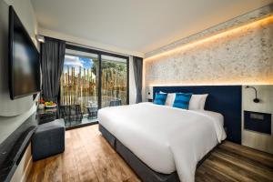 Letto o letti in una camera di Hotel Clover Patong Phuket - SHA Plus
