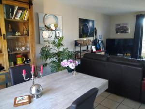 a dining room with a table with two candles on it at Chambre in Carcassonne