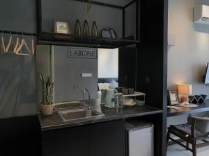 a kitchen with a sink and a counter at Aeropod Studio - Laxzone in Kota Kinabalu