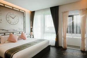 Ένα ή περισσότερα κρεβάτια σε δωμάτιο στο SOOKNIRUND HOTEL