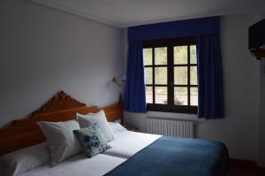 Cama o camas de una habitación en Hotel El Jisu
