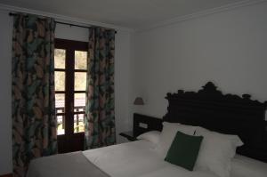Cama o camas de una habitación en Hotel El Jisu