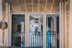 a view from the balcony of a building at Plaza Nueva apartment by People Rentals in Bilbao