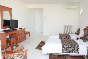 TV a/nebo společenská místnost v ubytování Hotel Bouregreg
