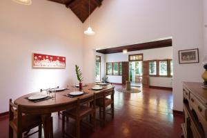 a large dining room with a table and chairs at Sweet Cinnamon Kandy in Kandy