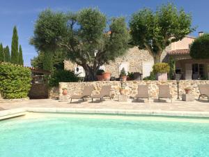 The swimming pool at or near Bastide de Fontvieille