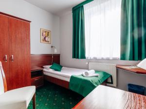 Postel nebo postele na pokoji v ubytování Hotel Skalite Spa & Wellness