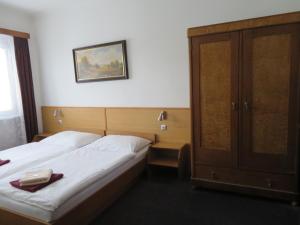 Postel nebo postele na pokoji v ubytování Hotel Lux