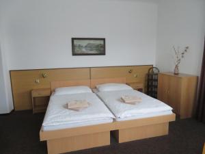 Postel nebo postele na pokoji v ubytování Hotel Lux