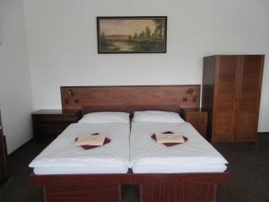 Postel nebo postele na pokoji v ubytování Hotel Lux
