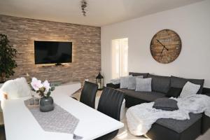 a living room with a couch and a table at Apartman Dario in Čara
