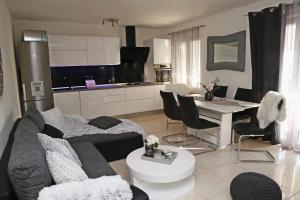 a living room with a couch and a table at Apartman Dario in Čara +35 photos