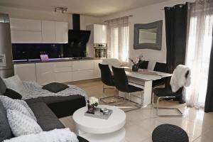 a living room with a couch and a table at Apartman Dario in Čara