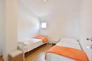 Postel nebo postele na pokoji v ubytování Apartment Jukic + 37 fotografií