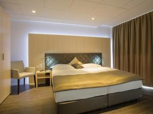 Postel nebo postele na pokoji v ubytování Los Lorentes Hotel Bern Airport