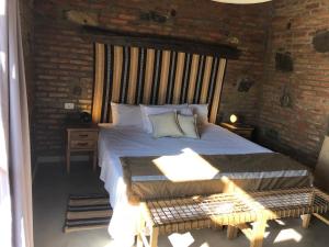 Postel nebo postele na pokoji v ubytování La Ceiba