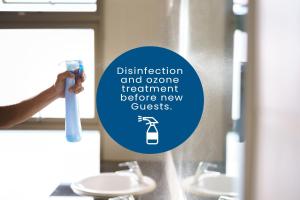 a person is holding a toothbrush in a bathroom at ClickTheFlat Aleje Jerozolimskie Center Apart Rooms in Warsaw +6 photos
