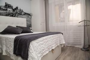 Voodi või voodid majutusasutuse Alojamientos Rooms Catamarán toas