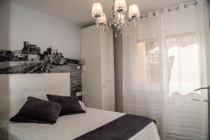 Voodi või voodid majutusasutuse Alojamientos Rooms Catamarán toas