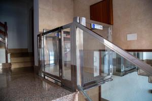 an elevator in a building with an escalator at Alojamientos CATAMARAN in Castro-Urdiales