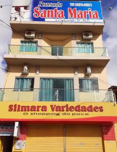 un edificio con un cartel para un restaurante Santa Marina en Pousada Santa Maria en Euclides da Cunha