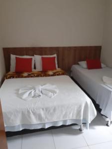 מיטה או מיטות בחדר ב-Pousada Santa Maria
