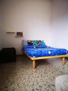 Ein Bett oder Betten in einem Zimmer der Unterkunft S'arrulloni