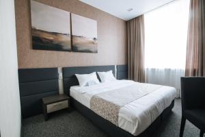 Tempat tidur dalam kamar di Panorama Hotel