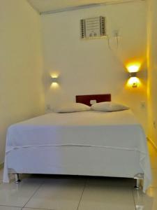 Postel nebo postele na pokoji v ubytování Hotel Pousada Hamburgo