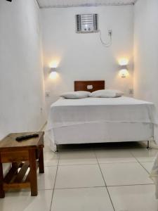 Postel nebo postele na pokoji v ubytování Hotel Pousada Hamburgo